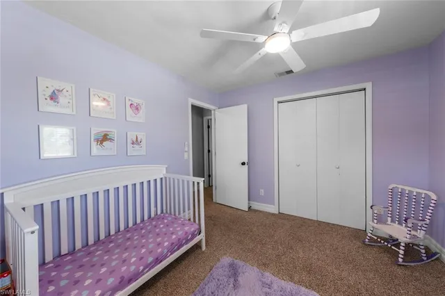 a view of a bedroom with furniture and wooden floor