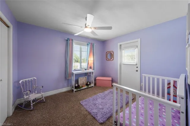 a bedroom with furniture and a window