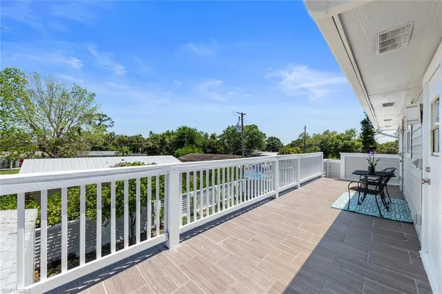 an aerial view of a house with a yard basket ball court and outdoor seating
