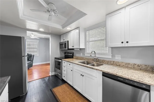 a kitchen with a sink stove and refrigerator