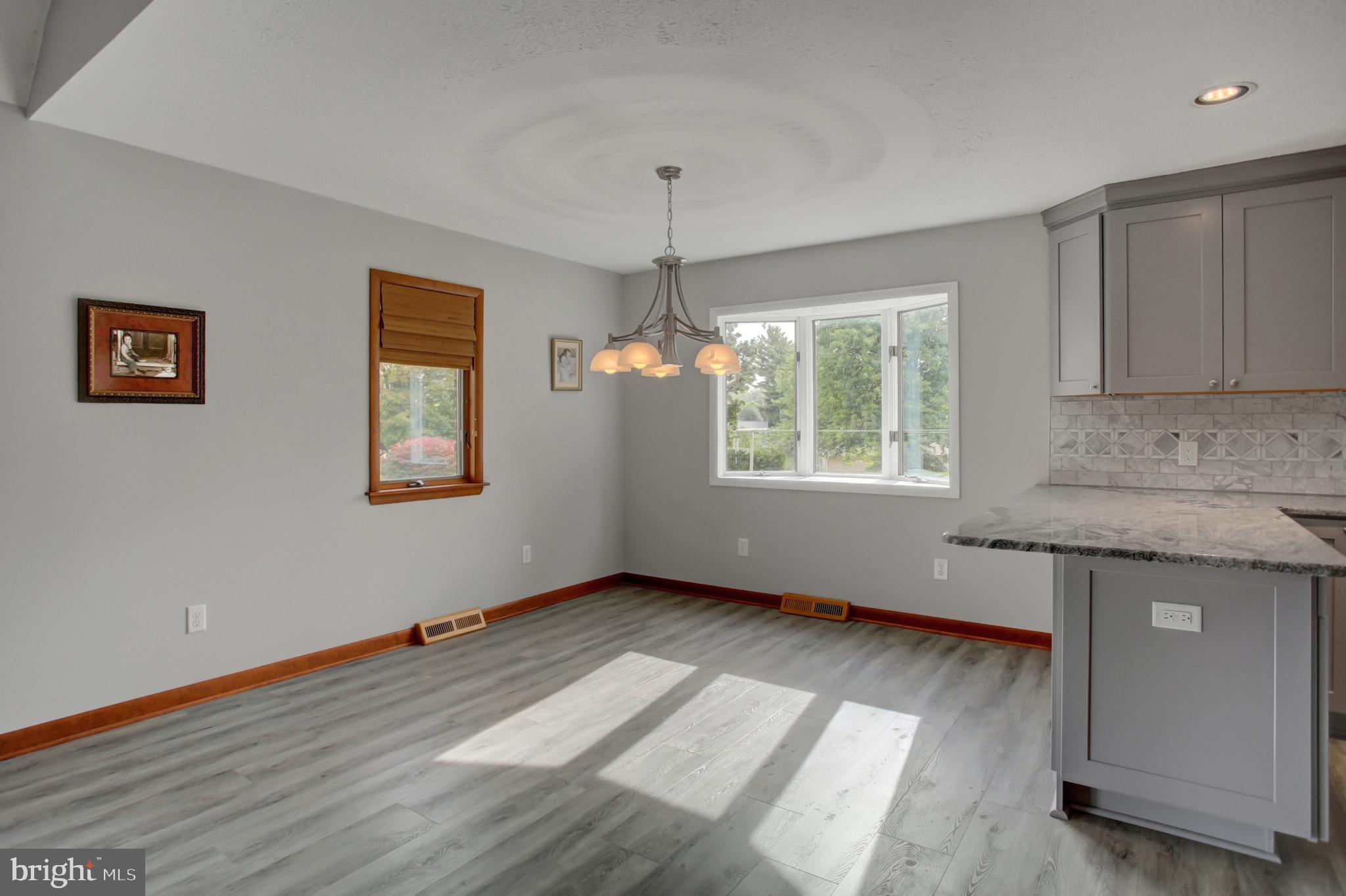 10050 McCreary Road Shippensburg, PA 17257 - Photo 14 of 64 a kitchen with granite countertop a stove a sink and a window