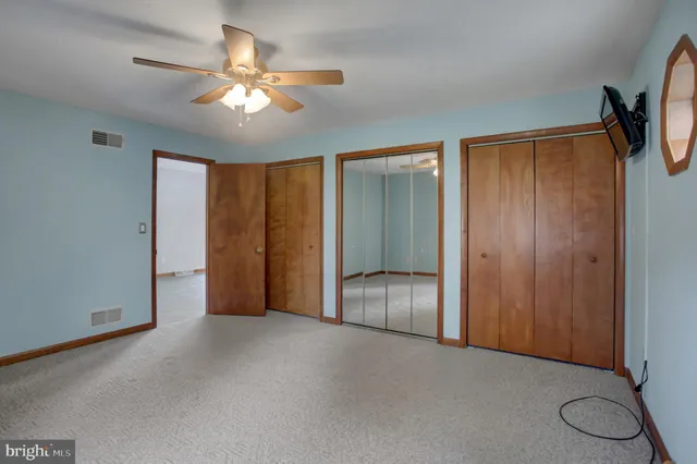 a living room with furniture a table and a window