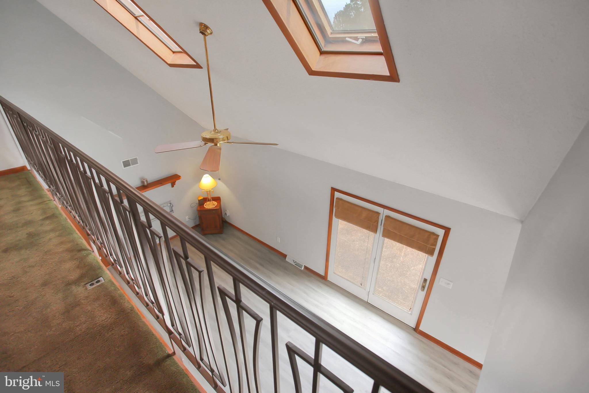 10050 McCreary Road Shippensburg, PA 17257 - Photo 34 of 64 a view of staircase with wooden floor and fan