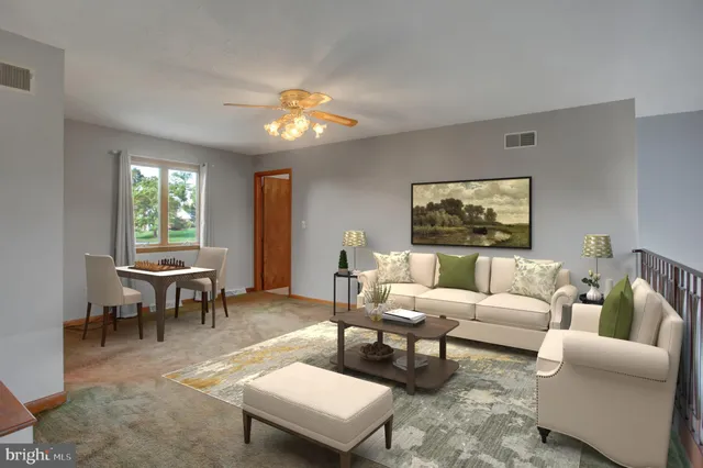 an empty room with a ceiling fan and a window