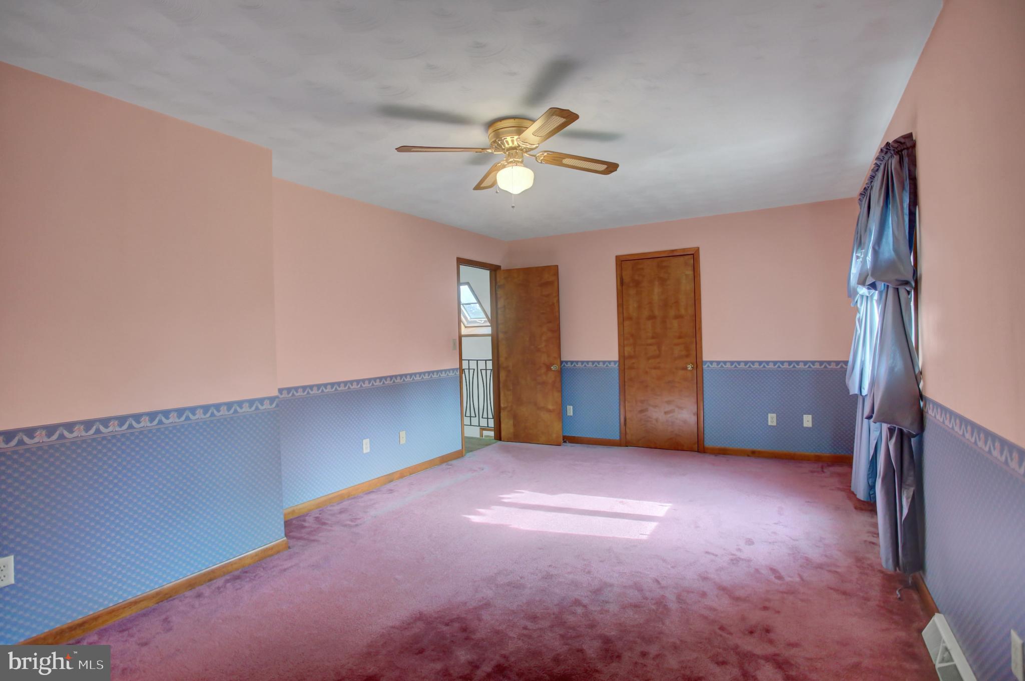 10050 McCreary Road Shippensburg, PA 17257 - Photo 40 of 64 a view of an empty room with a ceiling fan