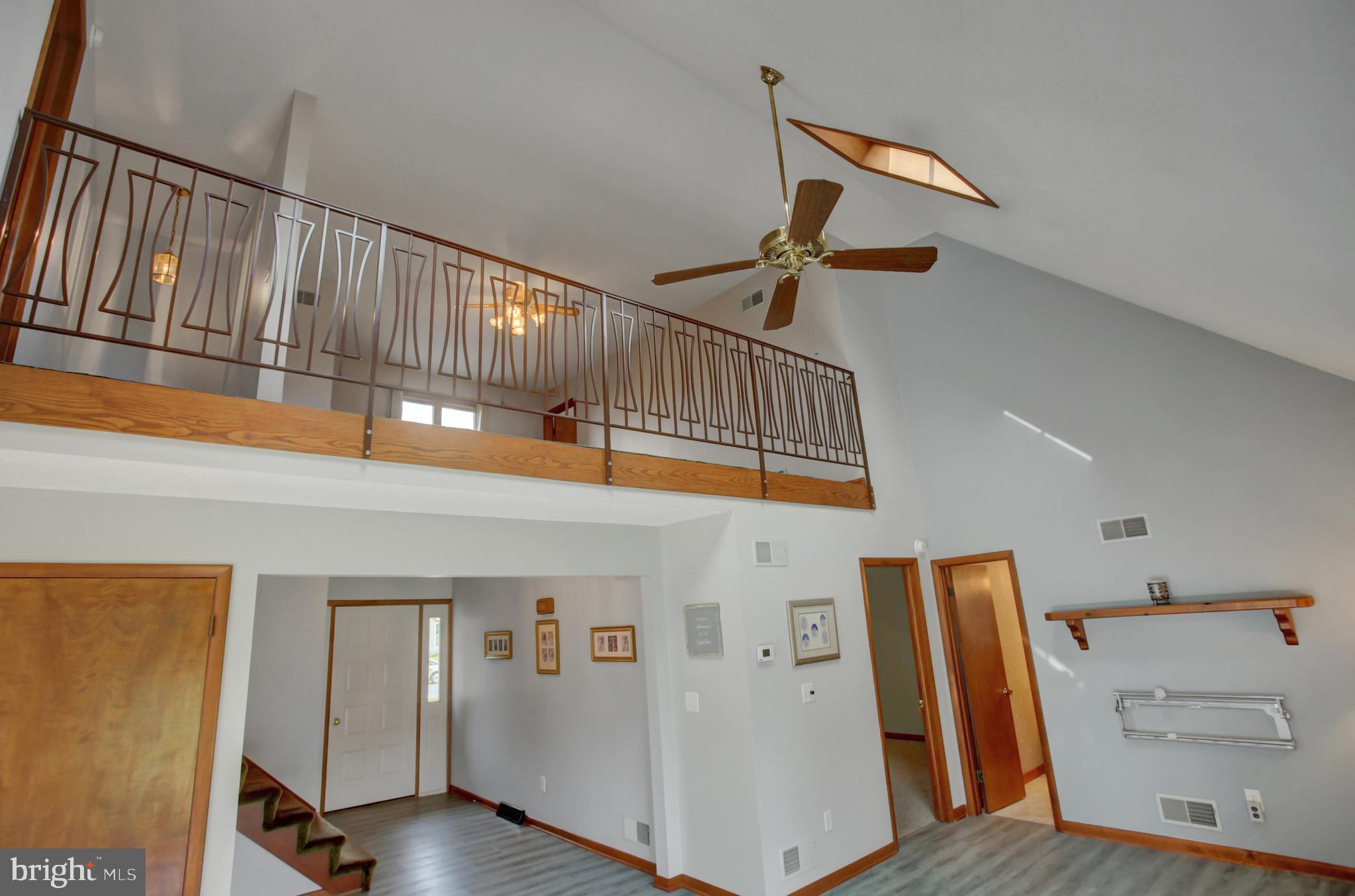10050 McCreary Road Shippensburg, PA 17257 - Photo 8 of 64 a view of a hallway with entryway a wooden floor and front door