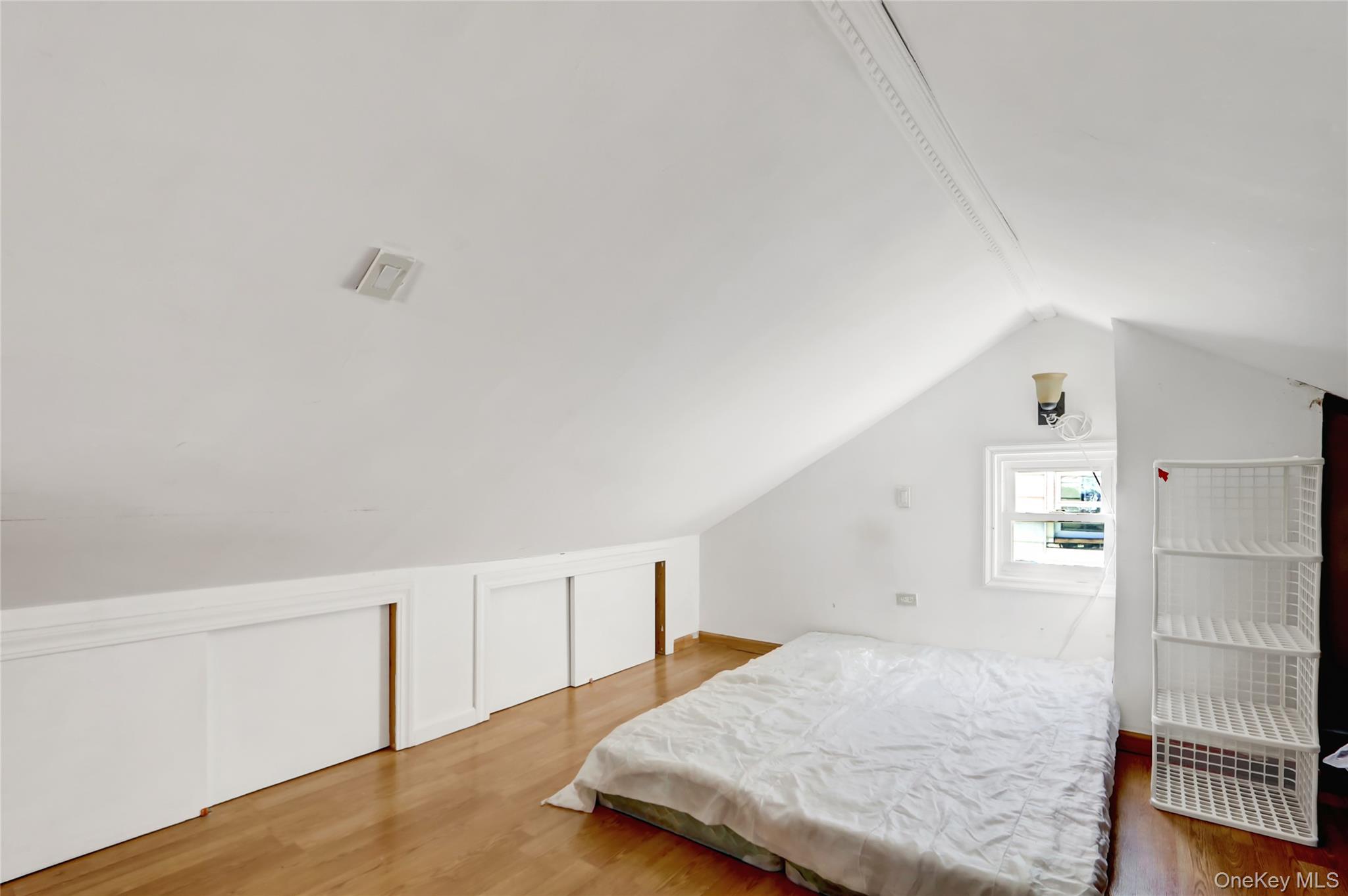 6 Walnut Place Great Neck, NY 11021 - Photo 15 of 19 a bedroom with a bed and a window