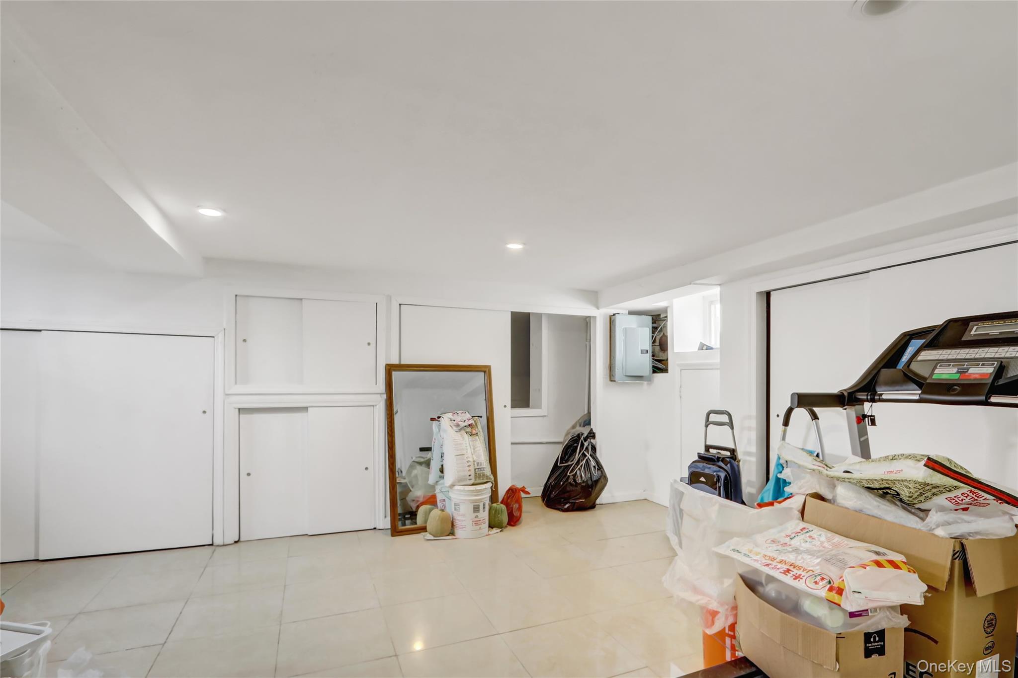 6 Walnut Place Great Neck, NY 11021 - Photo 16 of 19 a view of a room with gym equipment