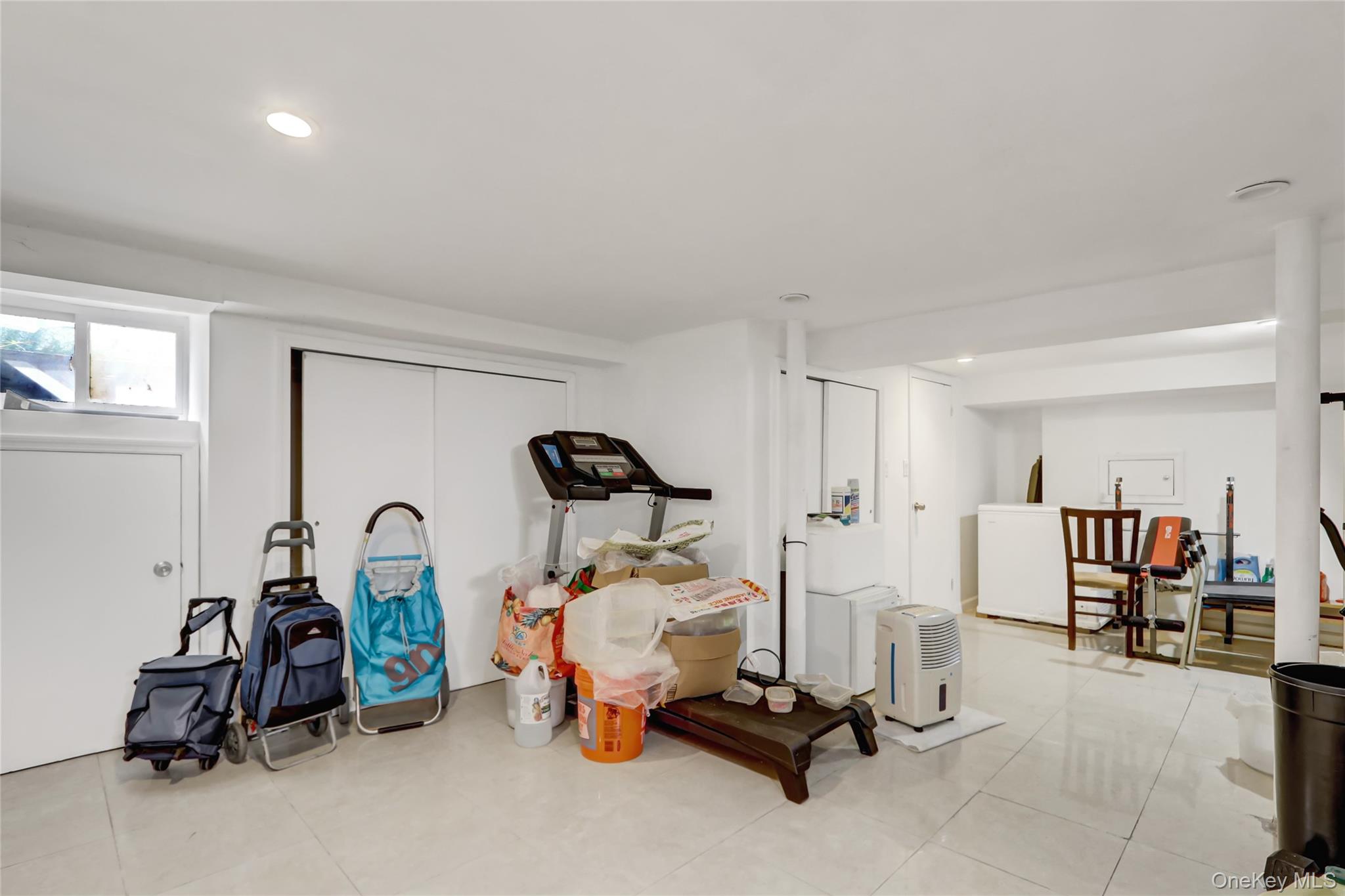 6 Walnut Place Great Neck, NY 11021 - Photo 17 of 19 a view of a room with gym equipment