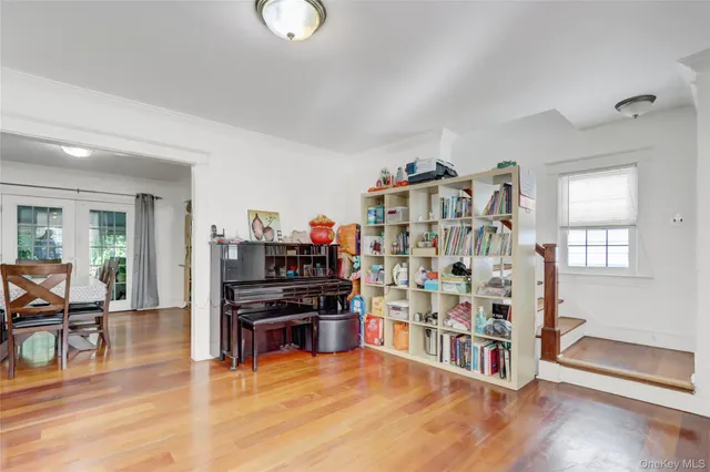 a view of a livingroom with furniture and an empty room