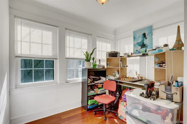 a workspace with furniture and window