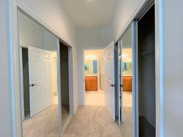 a bathroom with a granite countertop sink mirror and shower