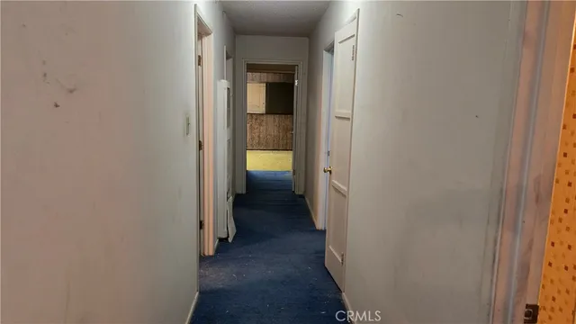 a view of a bathroom from a hallway