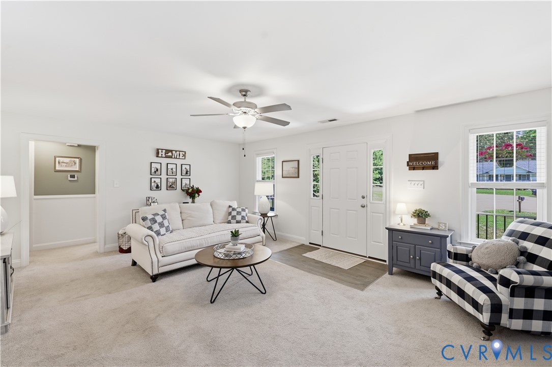 222 Oak Ridge Court Aylett, VA 23009 - Photo 7 of 35 Bright living area with light-toned carpeting and