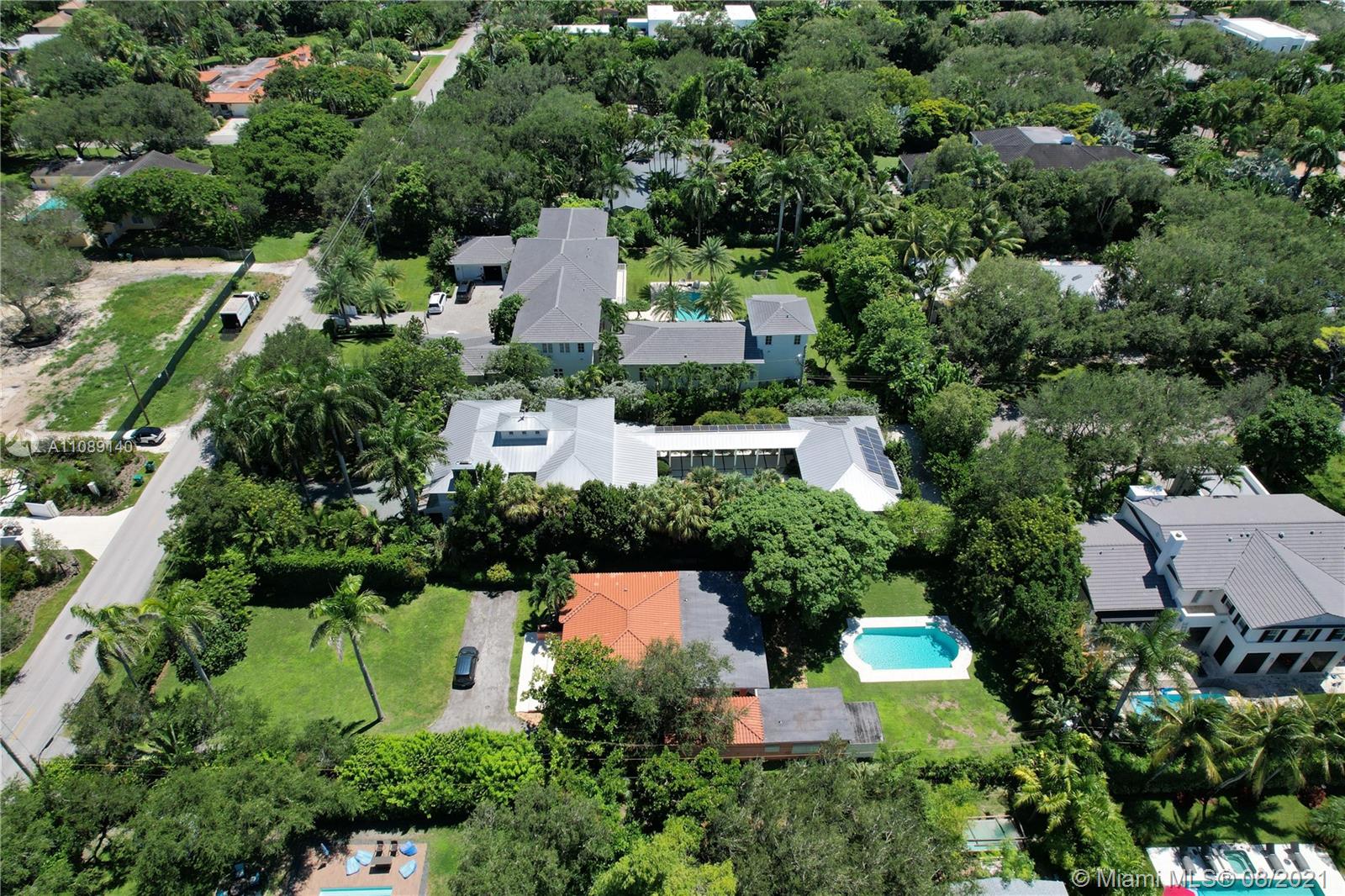 7670 Ponce De Leon Road Miami, FL 33143 - Photo 4 of 6 an aerial view of house with swimming pool outdoor seating and yard