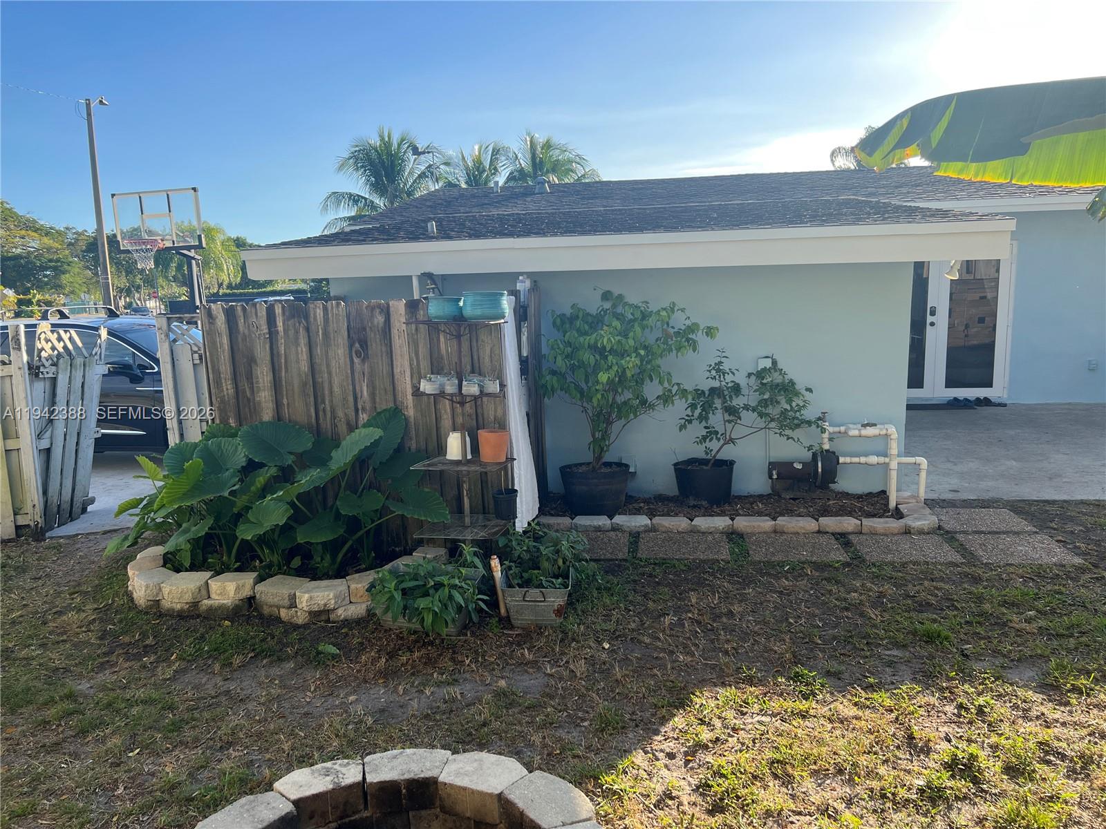8801 Southwest 42nd Street Miami, FL 33165 - Photo 19 of 75 a view of a porch with furniture and floor to ceiling window