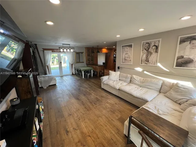 a view of a refrigerator in kitchen and wooden floor