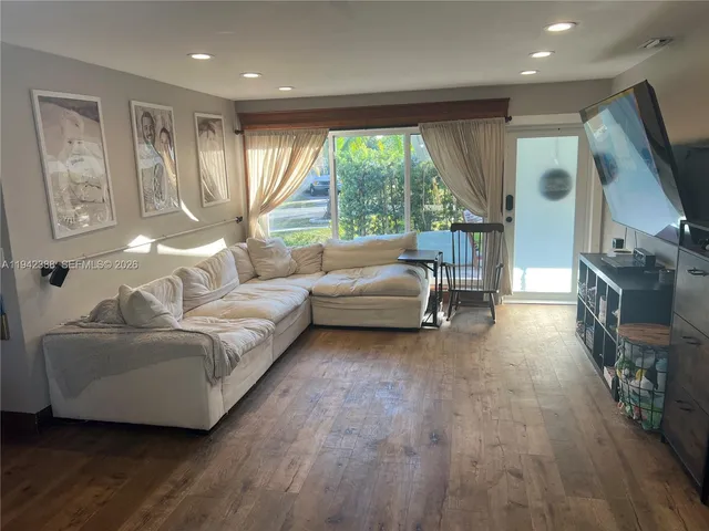 a kitchen with stainless steel appliances a refrigerator and a stove top oven