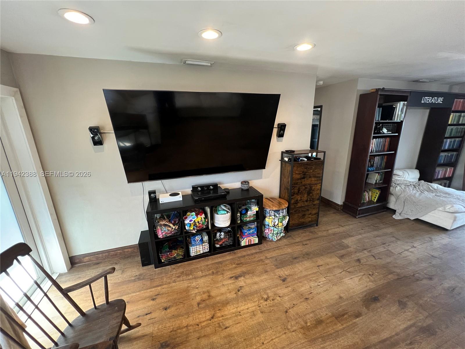 8801 Southwest 42nd Street Miami, FL 33165 - Photo 25 of 75 a living room with furniture and a flat screen tv