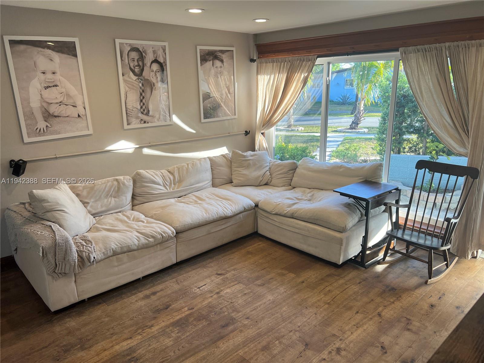 8801 Southwest 42nd Street Miami, FL 33165 - Photo 26 of 75 a living room with furniture and a large window
