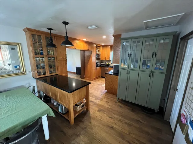 a kitchen with a stove and a microwave