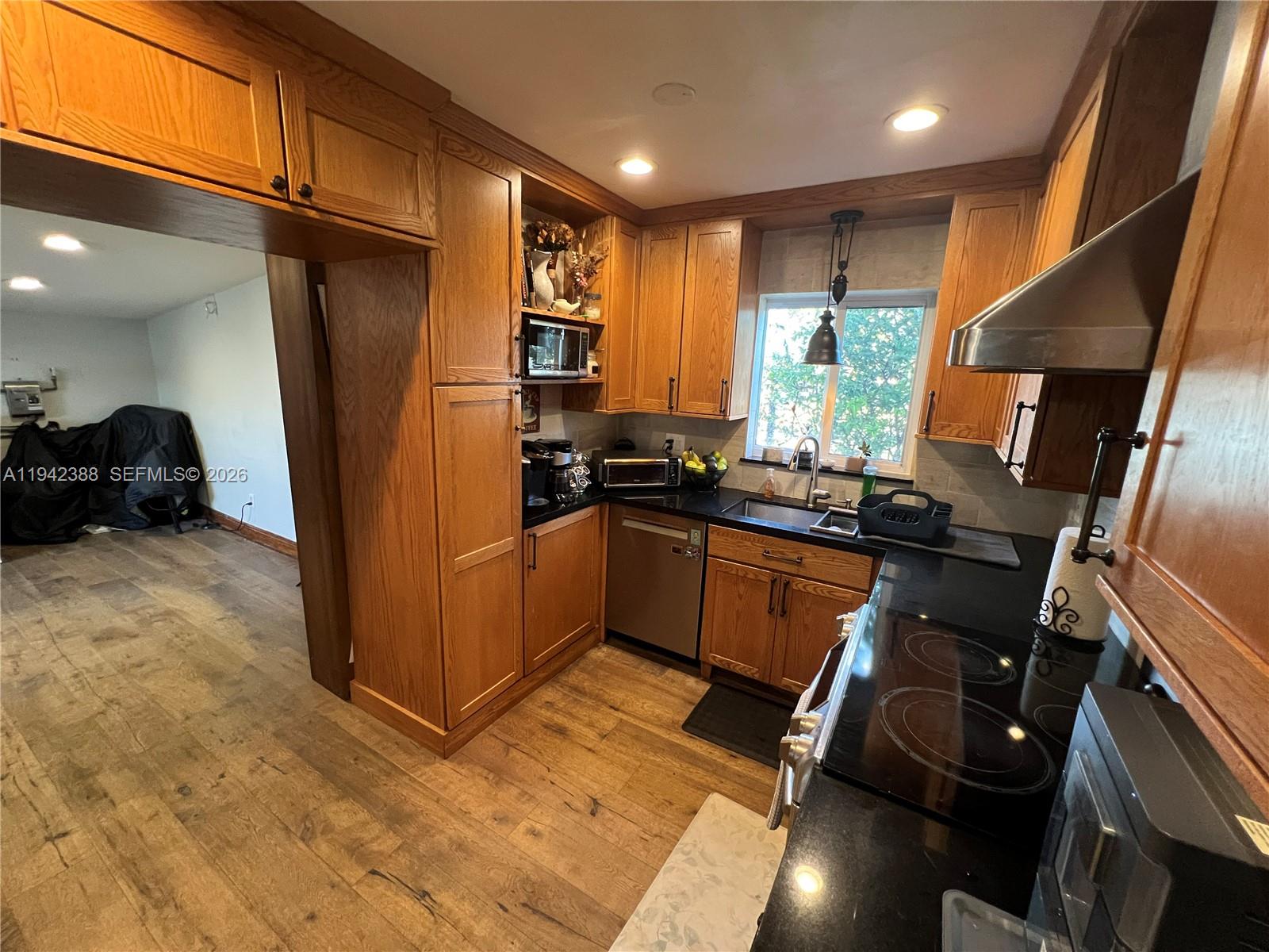8801 Southwest 42nd Street Miami, FL 33165 - Photo 33 of 75 a kitchen with refrigerator and window