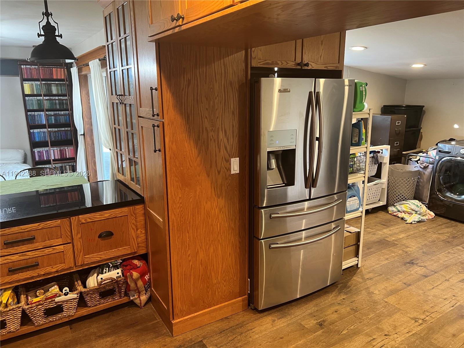 8801 Southwest 42nd Street Miami, FL 33165 - Photo 35 of 75 a kitchen with stainless steel appliances a refrigerator and a stove top oven