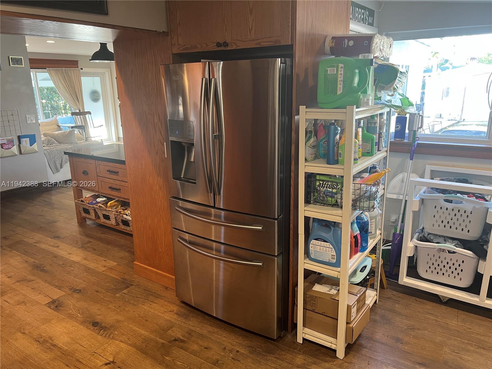 8801 Southwest 42nd Street Miami, FL 33165 - Photo 36 of 75 a kitchen with a refrigerator and a view of living room