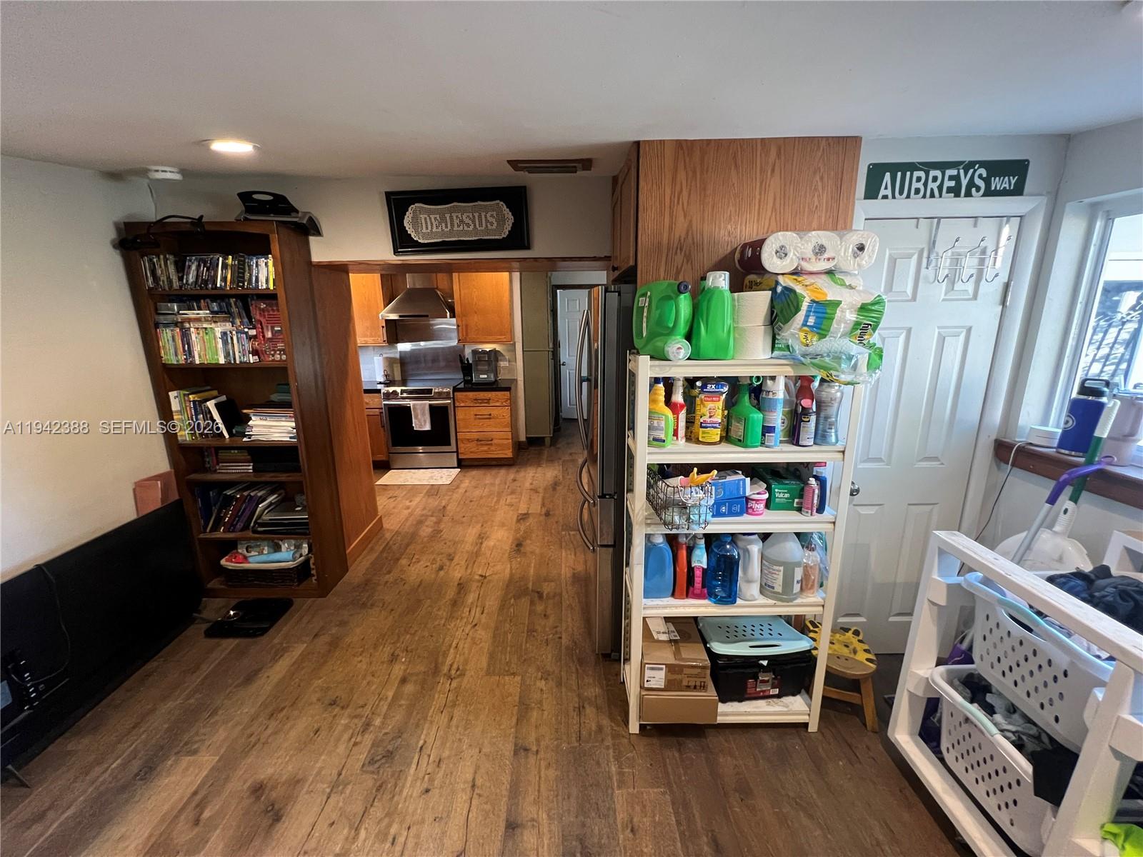 8801 Southwest 42nd Street Miami, FL 33165 - Photo 39 of 75 a living room with furniture and a book shelf