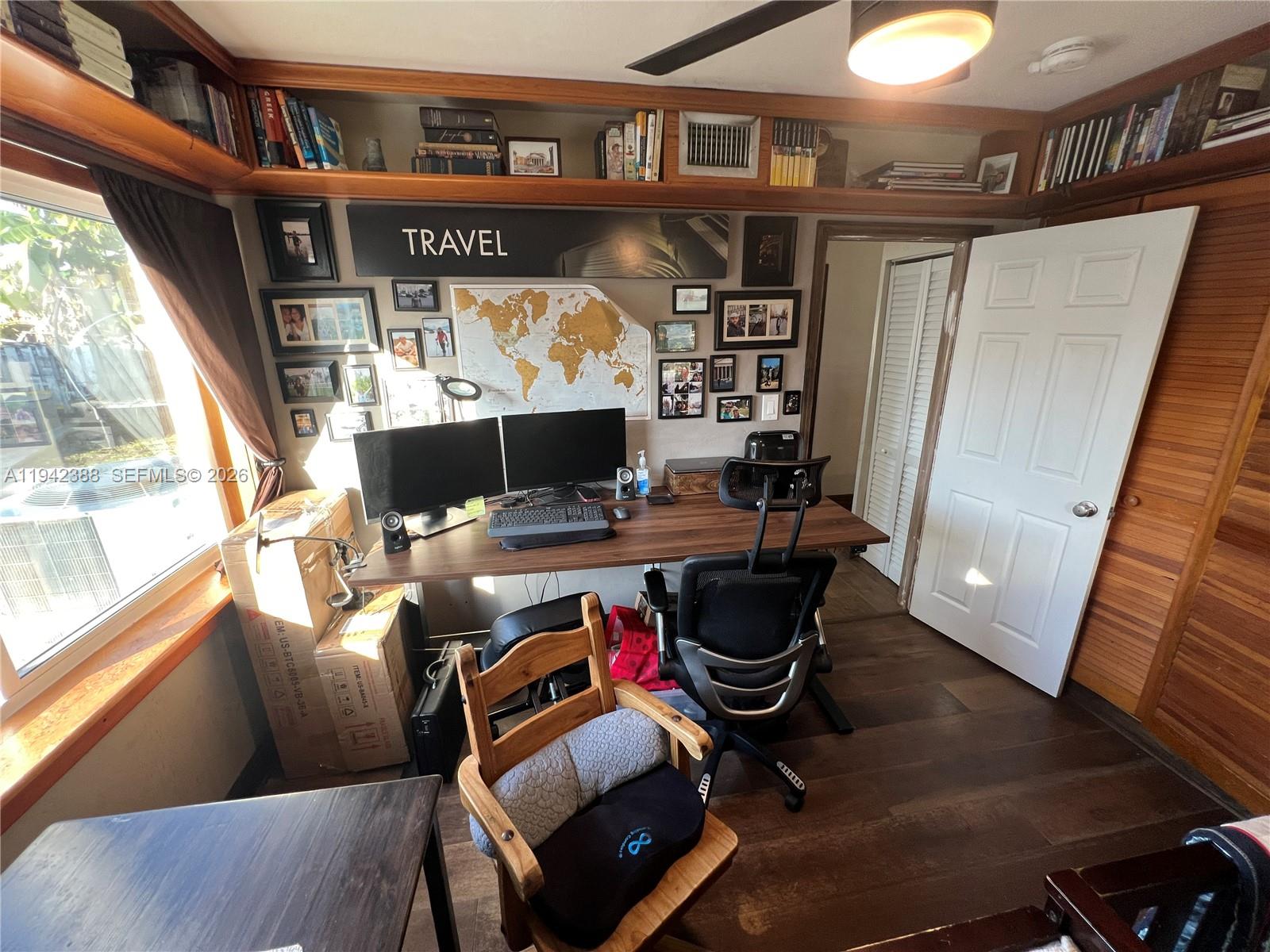 8801 Southwest 42nd Street Miami, FL 33165 - Photo 48 of 75 a living room with furniture and a flat screen tv