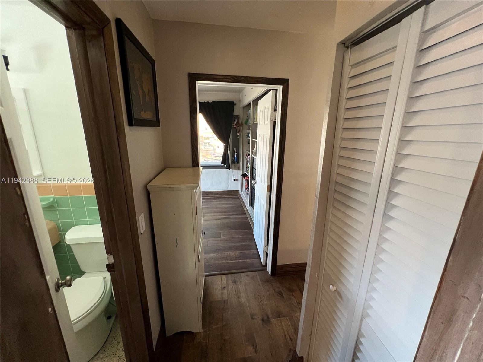 8801 Southwest 42nd Street Miami, FL 33165 - Photo 52 of 75 a view of a hallway with wooden floor and stairs