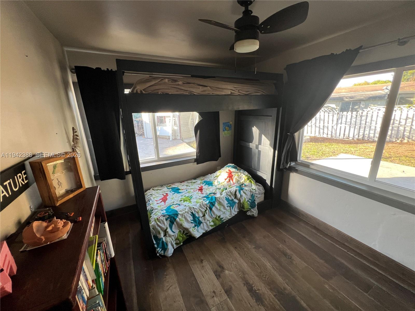 8801 Southwest 42nd Street Miami, FL 33165 - Photo 59 of 75 a living room with furniture and a flat screen tv