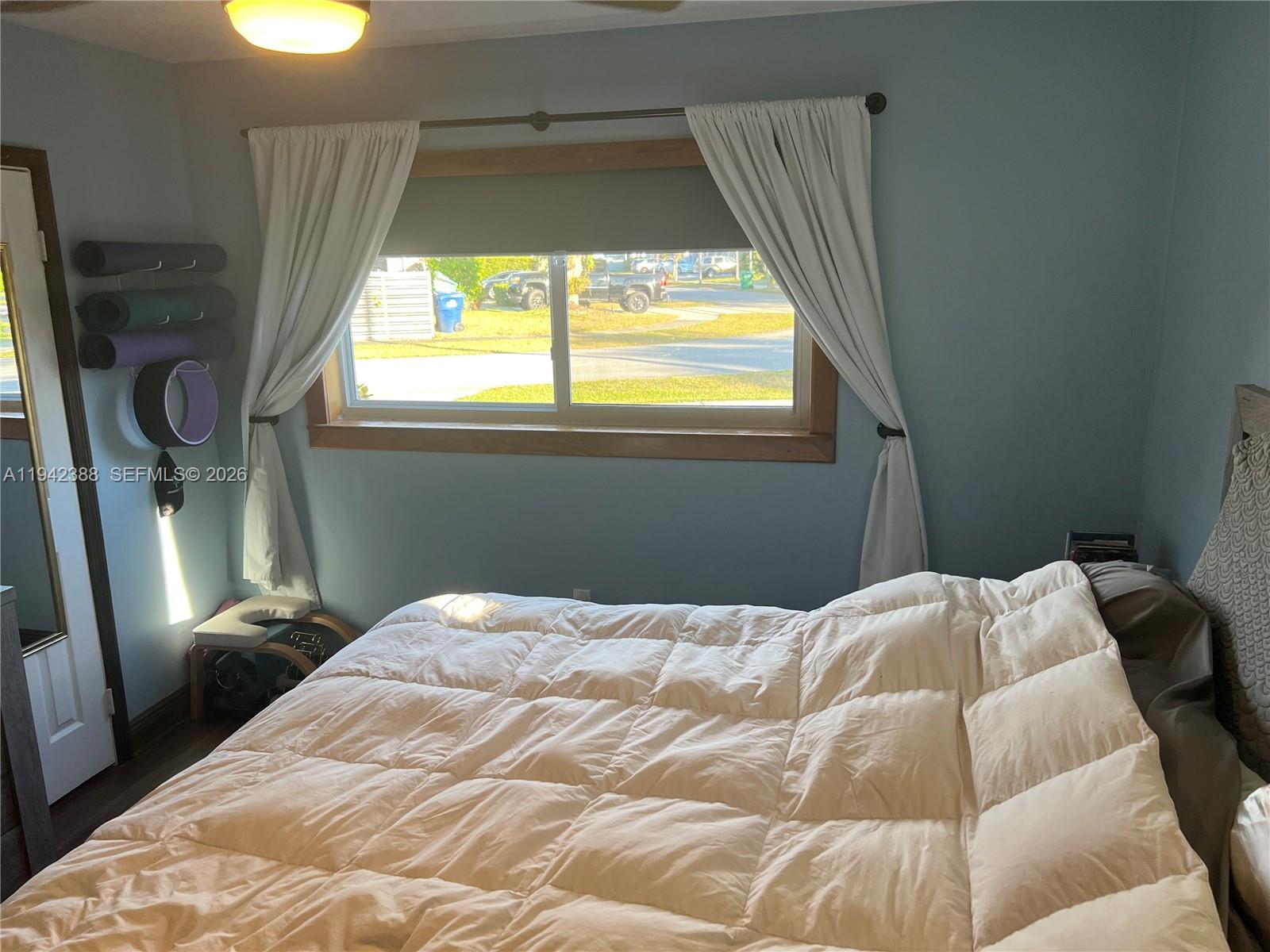 8801 Southwest 42nd Street Miami, FL 33165 - Photo 63 of 75 a bedroom with a bed and a window