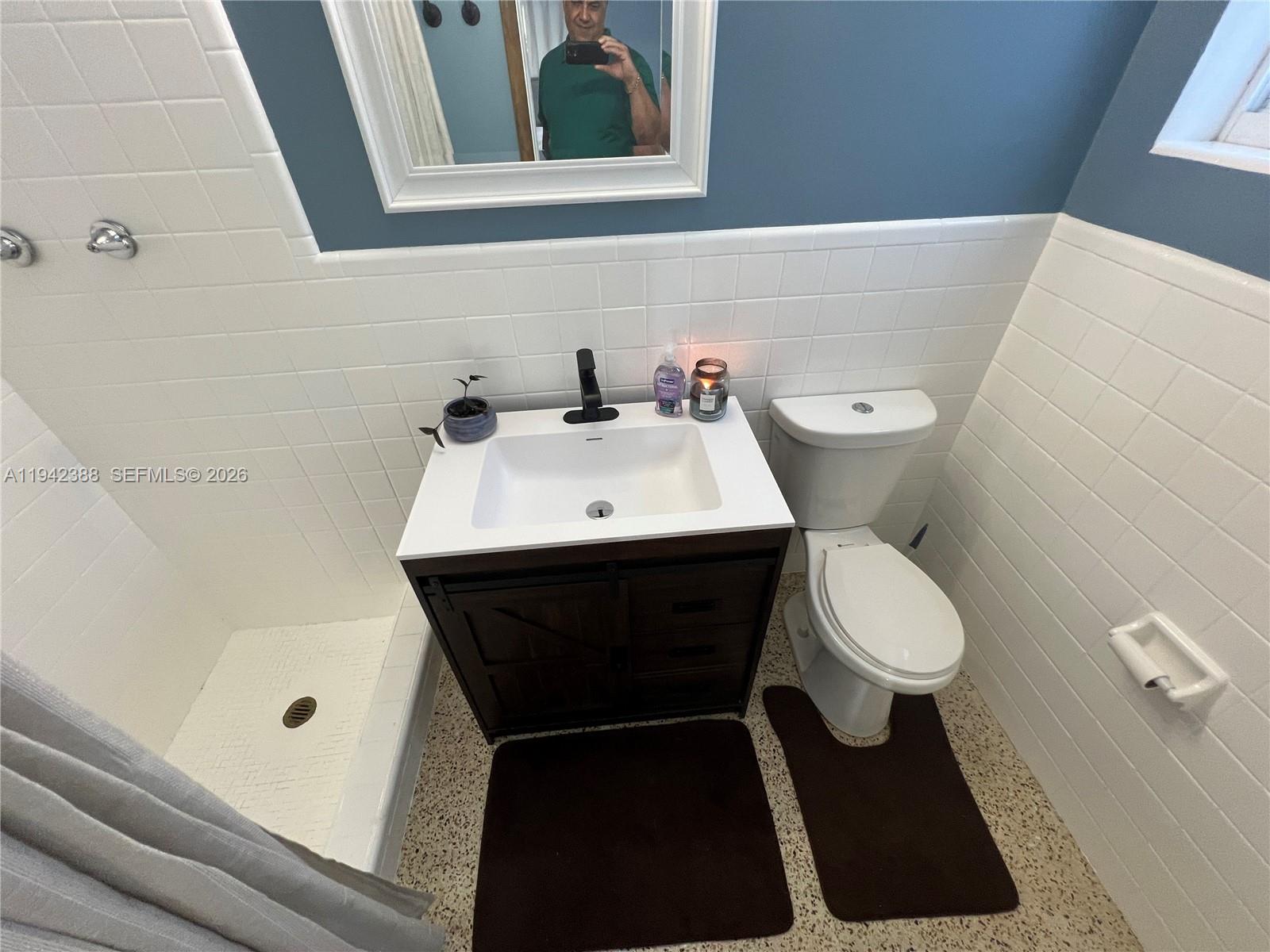 8801 Southwest 42nd Street Miami, FL 33165 - Photo 68 of 75 a bathroom with a sink and a toilet