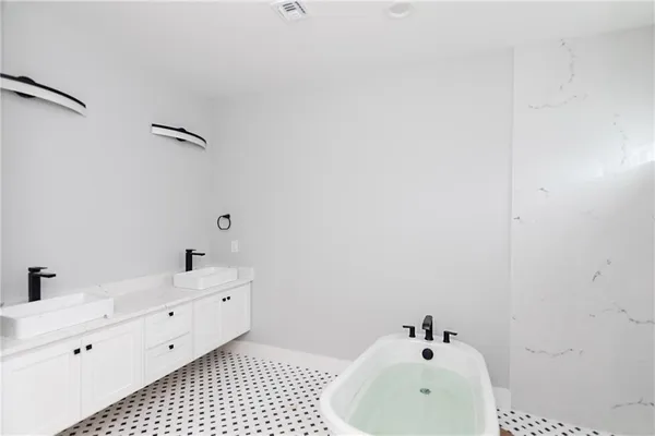 a bathroom with a sink and mirror