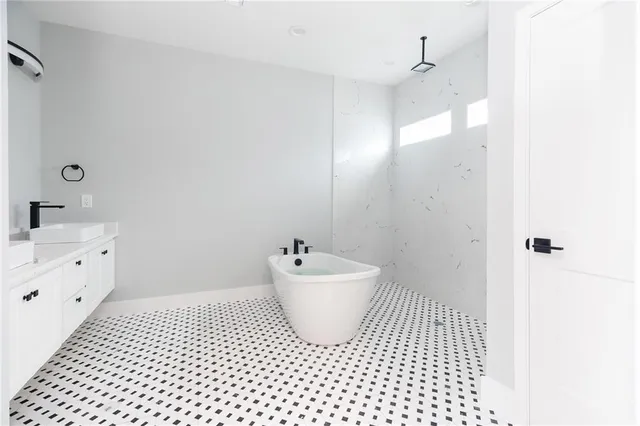 a bathroom with a sink a toilet and mirror