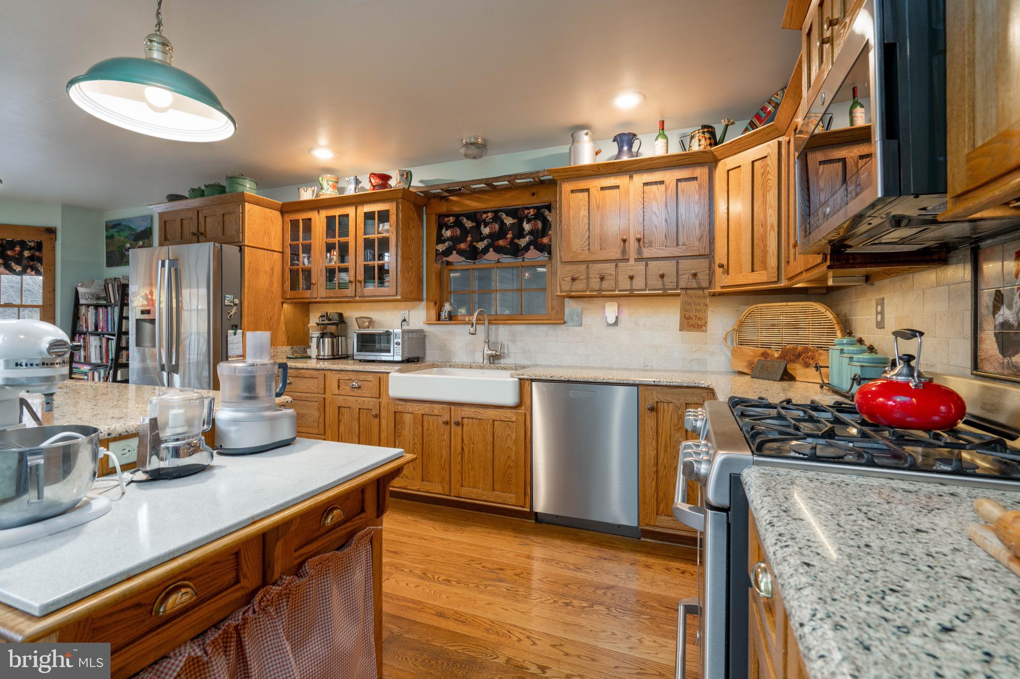 15 Phillip Drive Kirkwood, PA 17536 - Photo 11 of 52 a kitchen with stainless steel appliances granite countertop a sink a stove and a wooden floors