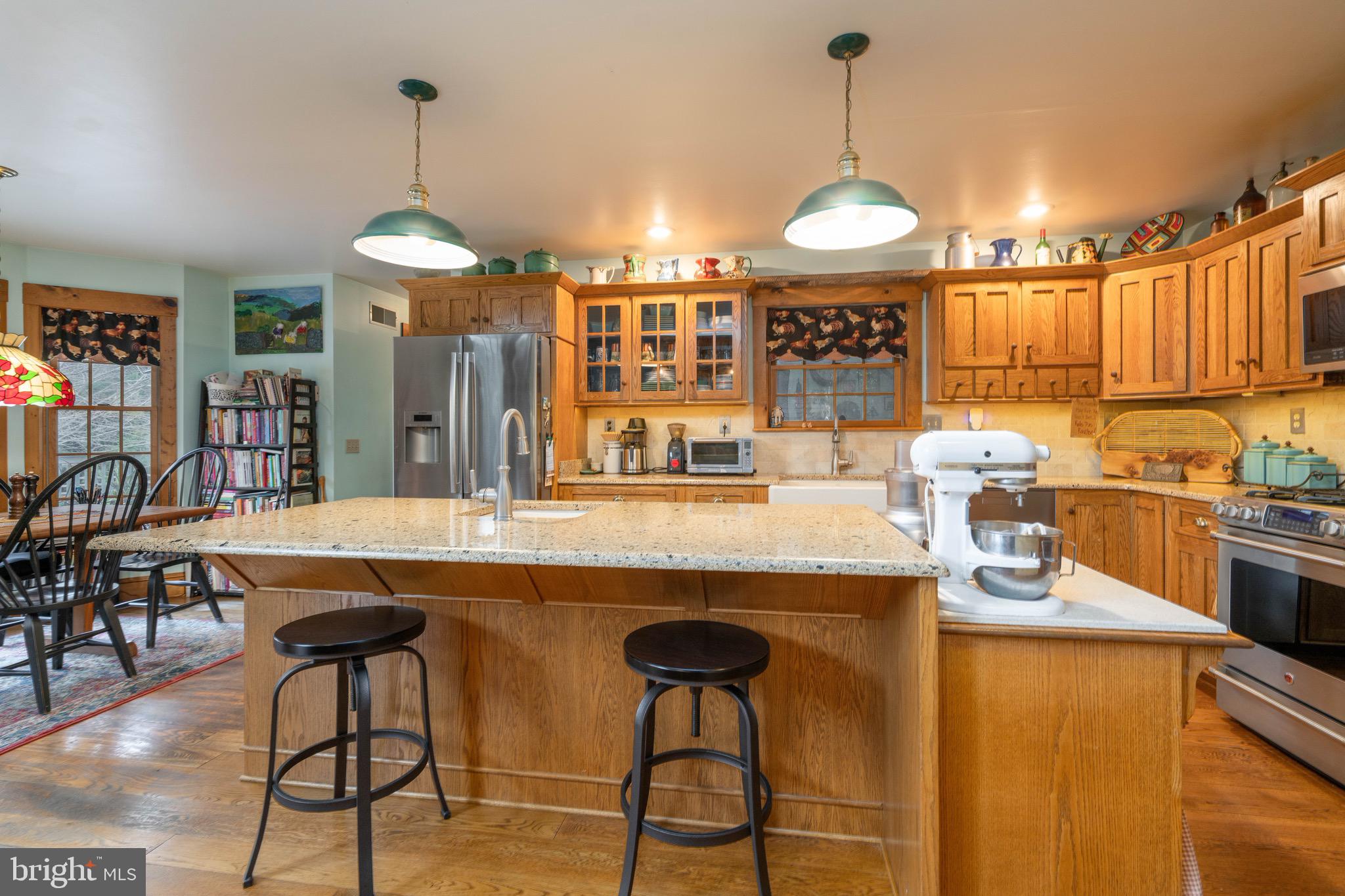 15 Phillip Drive Kirkwood, PA 17536 - Photo 12 of 52 a kitchen with stainless steel appliances granite countertop a sink a stove and a wooden floors