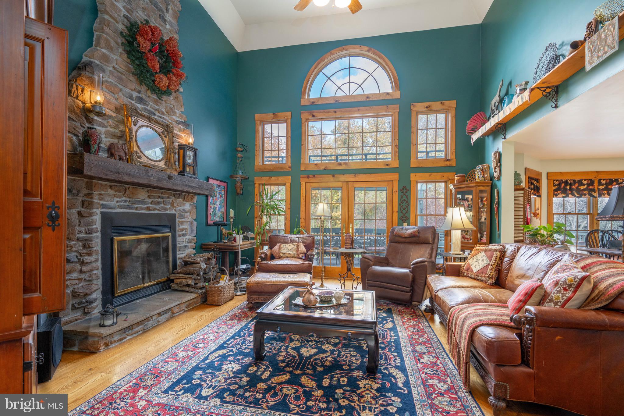 15 Phillip Drive Kirkwood, PA 17536 - Photo 16 of 52 a living room with furniture a chandelier and a fireplace