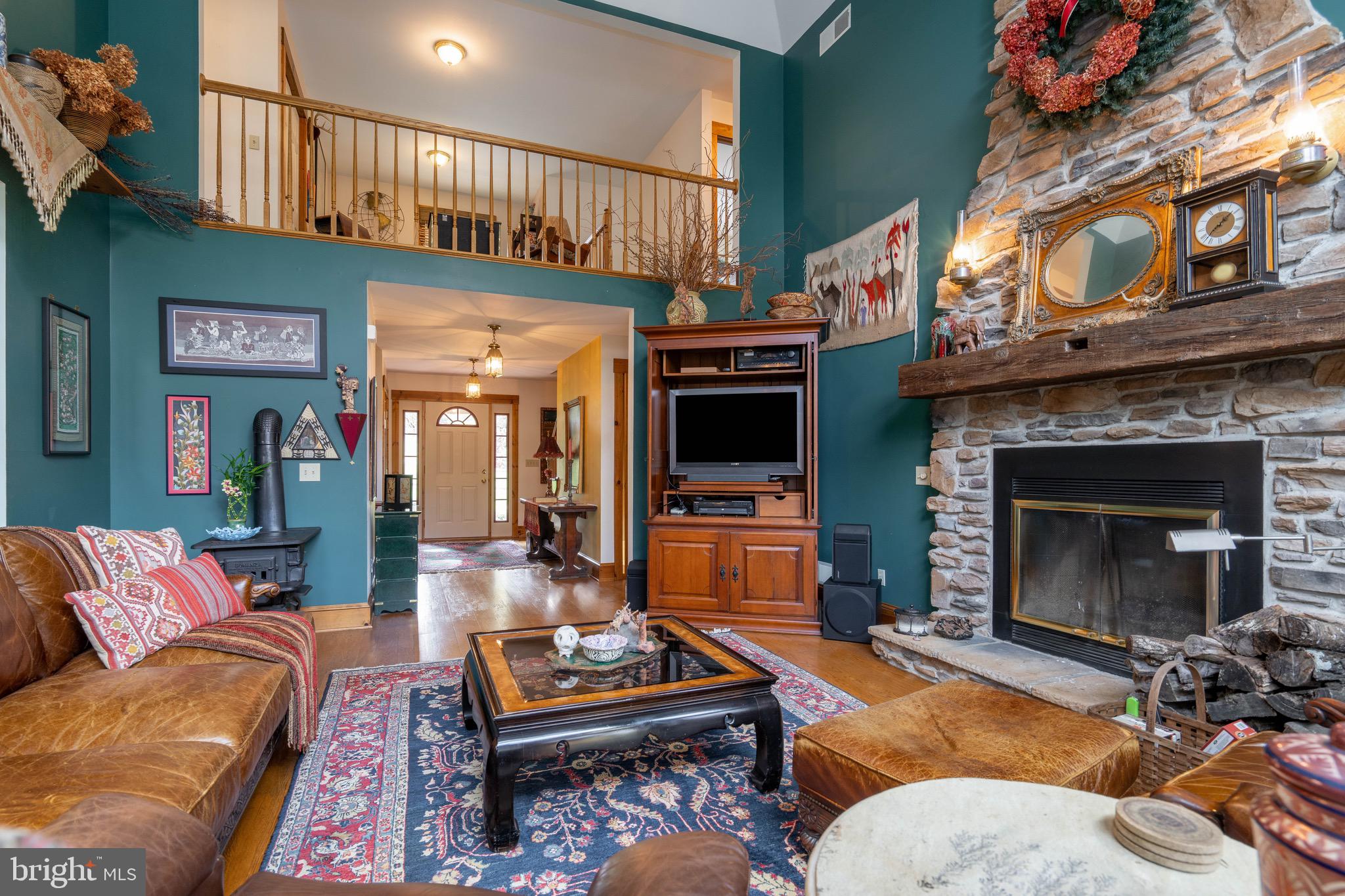 15 Phillip Drive Kirkwood, PA 17536 - Photo 17 of 52 a living room with furniture a flat screen tv and a fireplace