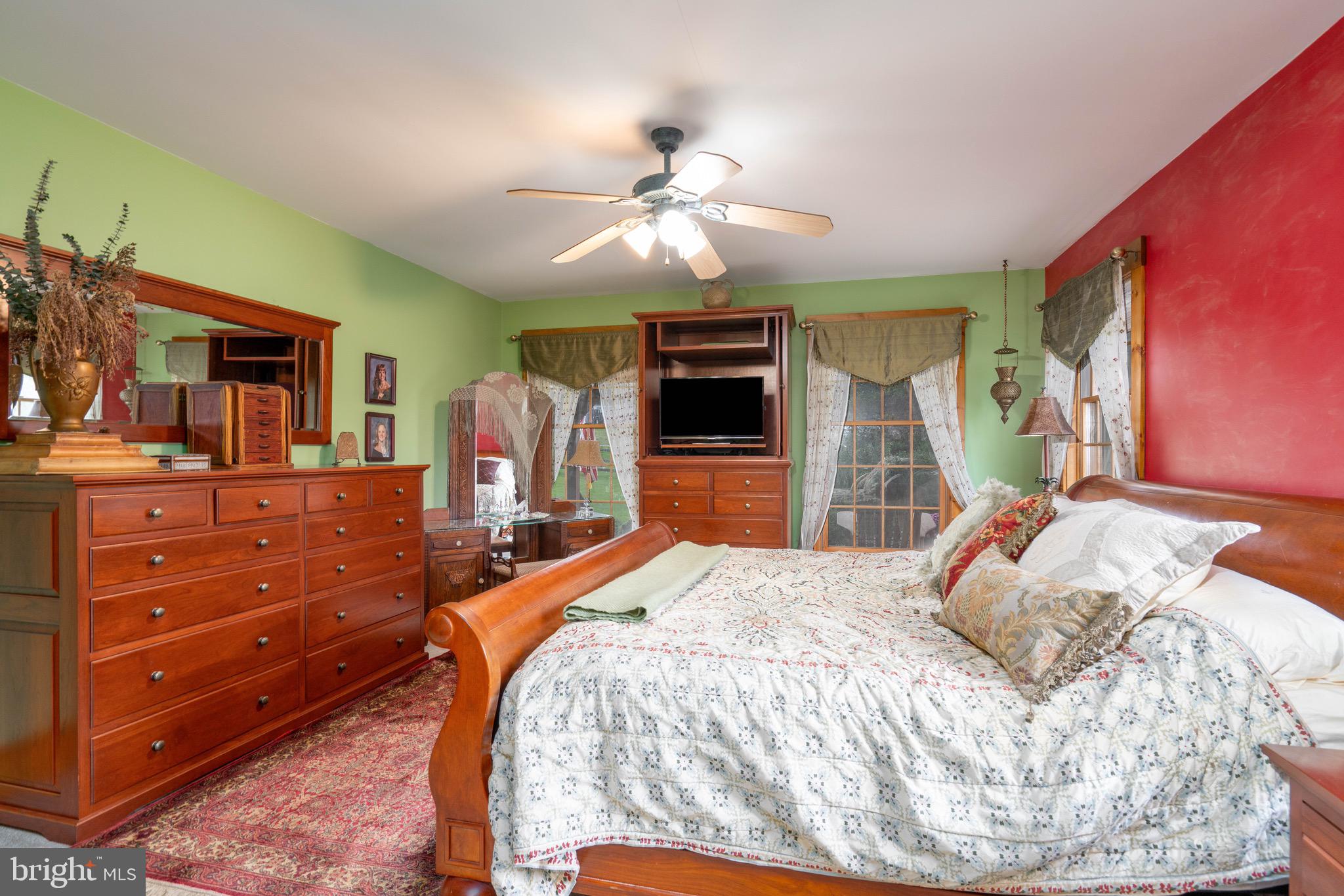 15 Phillip Drive Kirkwood, PA 17536 - Photo 24 of 52 a bedroom with a large bed and a flat tv screen on dresser