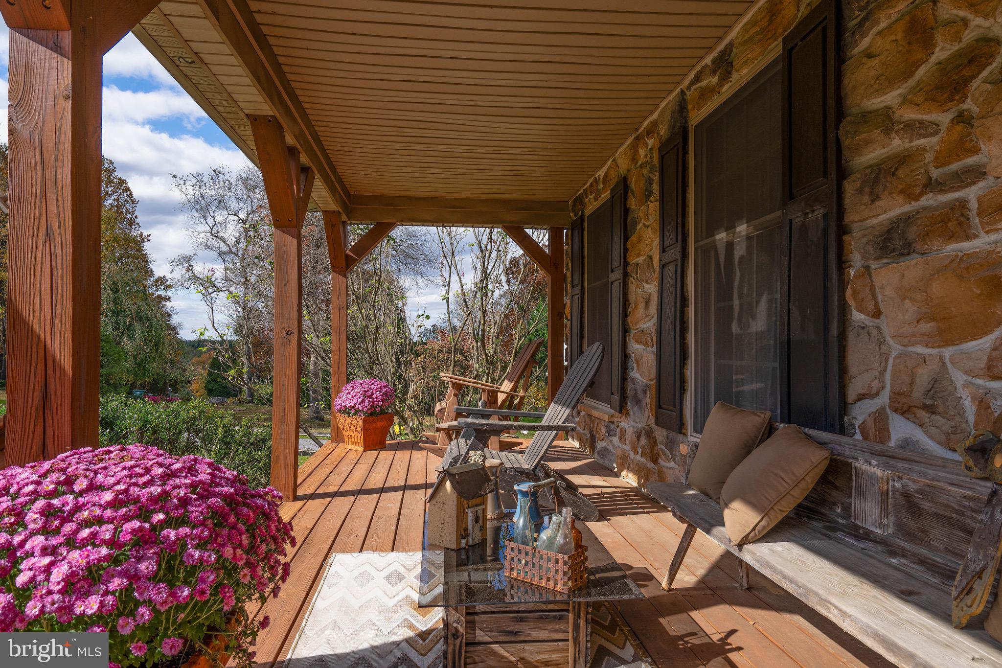 15 Phillip Drive Kirkwood, PA 17536 - Photo 4 of 52 a view of a patio with table and chairs and wooden floor