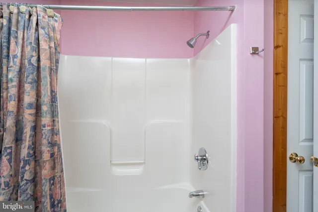 a view of a patio with table and chairs potted plants with wooden floor