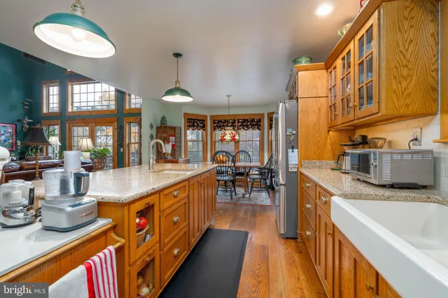 a large kitchen with lot of counter space and a sink