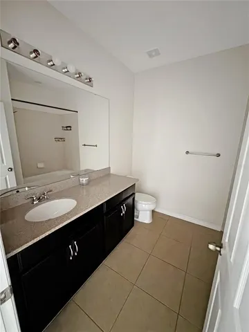 a bathroom with a double vanity sink and mirror