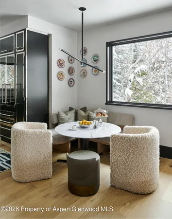 a view of a dining room with furniture window and outside view