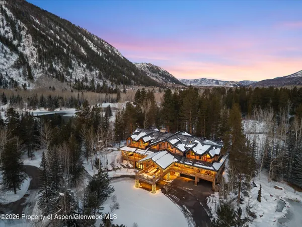 a view of swimming pool with a yard and mountain view