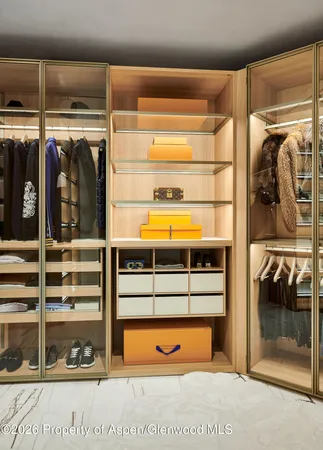 a bedroom with bed and a mirror