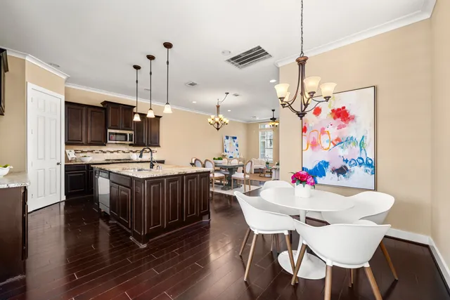 a bedroom with a large bed and ceiling fan