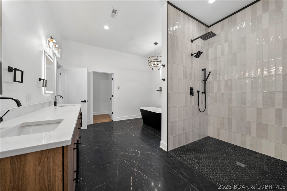 222 Red Bud Road Lake Ozark, MO 65049 - Photo 33 of 64 Luxurious primary bath offering a perfect blend of